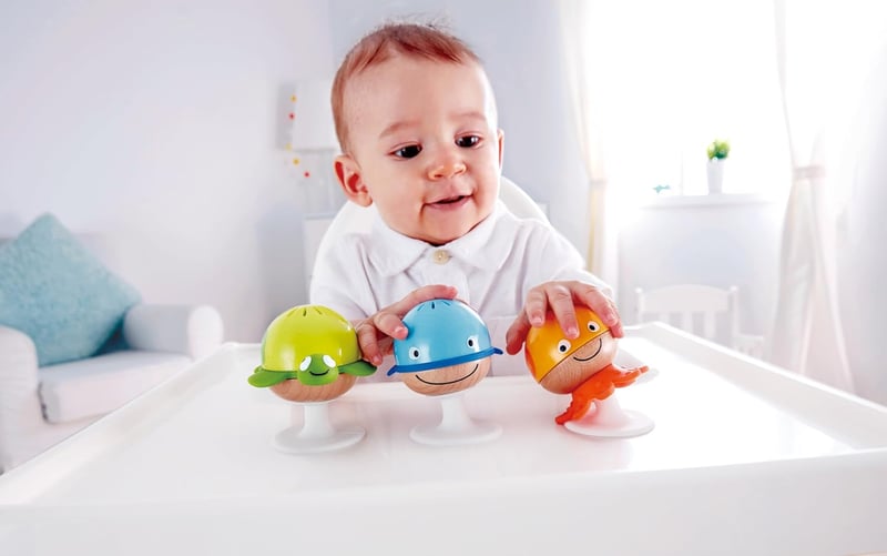Hape Rasselset mit Beißringen – Saugnapfspielzeug ab 0 Monaten