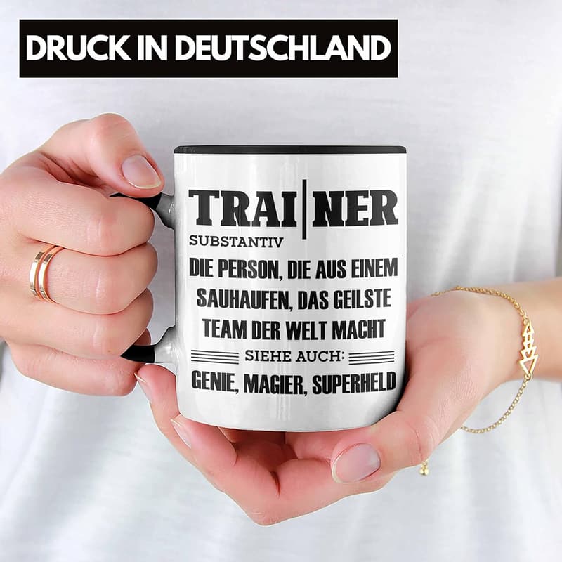 Kaffeetasse für den besten Coach – Füllung mit Motivation (Schwarz)