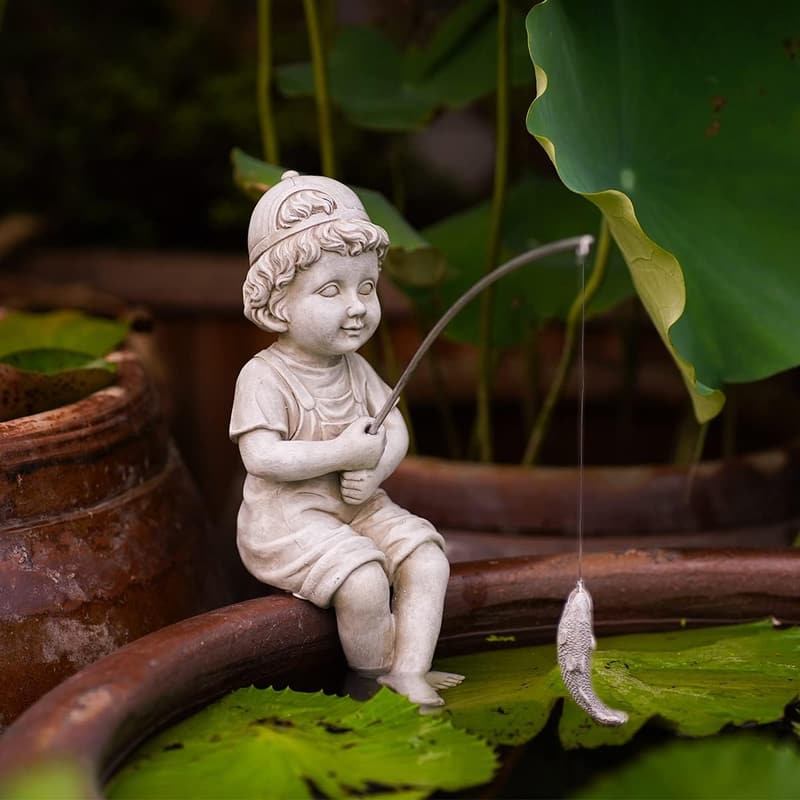 Fisherboy Garden Statue with Glow-in-the-Dark Pebbles